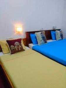 Postel nebo postele na pokoji v ubytování Peacock's Paradise Safari Hostel