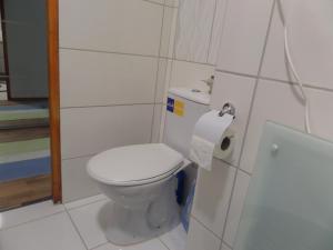 a bathroom with a toilet and a roll of toilet paper at DRS apartment, fully renovated flat in Budapest