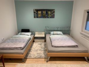 Tempat tidur dalam kamar di Ferienhaus Relax - Modernes Haus auf großem Grundstück im Grünen