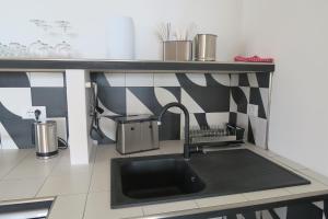 Kuchyň nebo kuchyňský kout v ubytování Villa Arianna - Suite Arianna