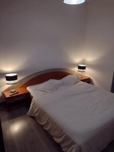 Cama ou camas em um quarto em Vivido Apartments