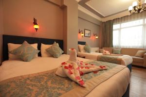 Katil atau katil-katil dalam bilik di White Pearl Apart