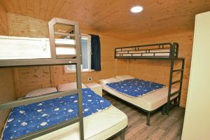 Krevet ili kreveti u jedinici u okviru objekta Camping Class +37 fotografija