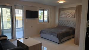 Postel nebo postele na pokoji v ubytování Andromeda Appartments - View to the Olympus + 17 fotografií