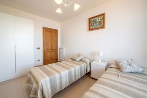 Posteľ alebo postele v izbe v ubytovaní Villa Miramare