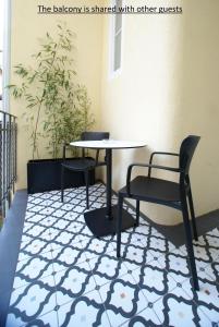 a table and two chairs and a table and chairs on a floor at Fingerprint Luxury Apartments in Zagreb