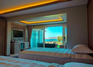 Postel nebo postele na pokoji v ubytování Roas Hotel Bodrum - City Center