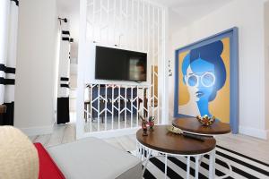 A television and/or entertainment centre at ALPSUITES SAFRAN