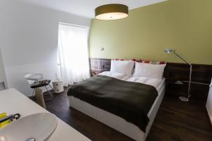 Letto o letti in una camera di Design Hotel Plattenhof