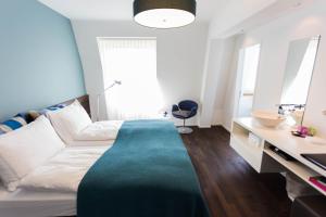 Letto o letti in una camera di Design Hotel Plattenhof