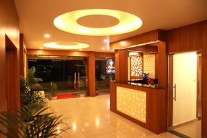 a large lobby with a large circular ceiling at ORFILA INN Airport Hotel in Angamali