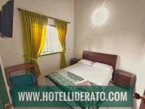 Postel nebo postele na pokoji v ubytování Hotel PARAMO LIDERATO