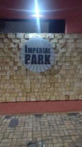 a sign that says imperial park on a stone wall at Imperial Park in Cornélio Procópio