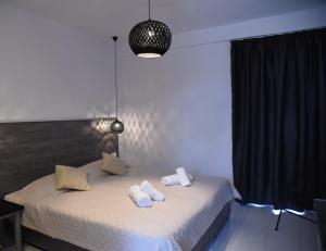 A bed or beds in a room at Katerina View