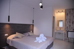 A bed or beds in a room at Katerina View