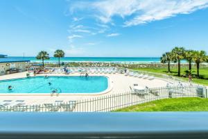 a view of a swimming pool and the beach at Moonspinner 211B in Panama City Beach