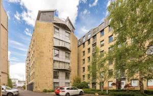 an external view of a building with cars parked in front at Edinburgh Penthouse 101 in Edinburgh