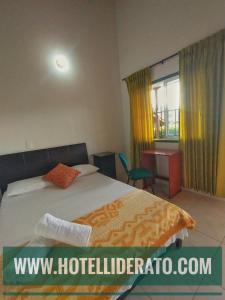 Postel nebo postele na pokoji v ubytování Hotel PARAMO LIDERATO