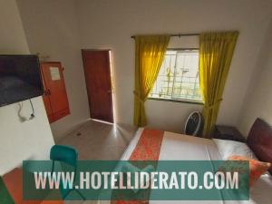 Postel nebo postele na pokoji v ubytování Hotel PARAMO LIDERATO