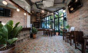 TV a/nebo společenská místnost v ubytování โรงแรม บอร์ดดิ้งเฮ้าส์