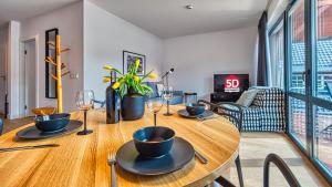 Televízia a/alebo spoločenská miestnosť v ubytovaní Apartament Triventi 98 z Widokiem- 5D Apartamenty