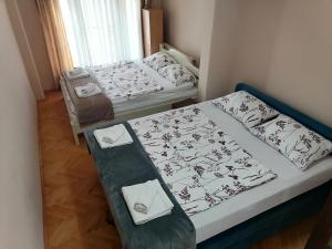 Postel nebo postele na pokoji v ubytování Apartman Solomonovic