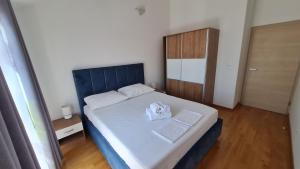 Postel nebo postele na pokoji v ubytování Apartmani Ferdi