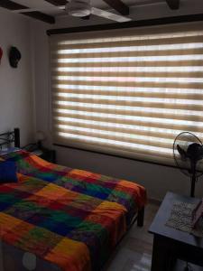 Postel nebo postele na pokoji v ubytování Casa comoda, bien ubicada en conjunto con piscina