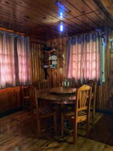 a wooden dining room with a table and chairs at Dagdag Village Homestay - Sagada in Sagada