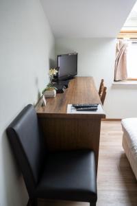 TV a/nebo společenská místnost v ubytování Hotel Monika