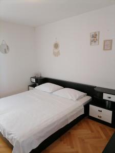 Postel nebo postele na pokoji v ubytování Apartman Nela