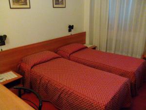 Postel nebo postele na pokoji v ubytování Albergo Alla Speranza