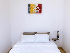 Postel nebo postele na pokoji v ubytování Whammy House Dalat