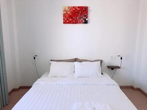 Postel nebo postele na pokoji v ubytování Whammy House Dalat