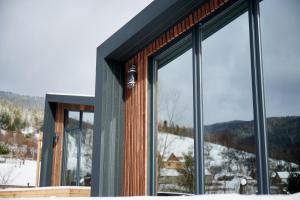 a room with windows with a view of a mountain at Blog House Resort in Yaremche