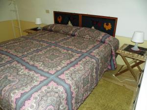 Ένα ή περισσότερα κρεβάτια σε δωμάτιο στο La Dolce Meta