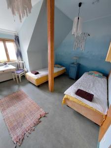 Voodi või voodid majutusasutuse Looming Hostel toas