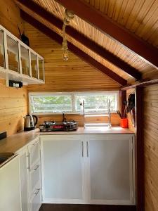 a kitchen with a sink and a counter top at Cinnamon View Lodge Mirissa in Mirissa