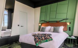 Un ou plusieurs lits dans un hébergement de l'établissement Hôtel Tandem - Boutique Hôtel