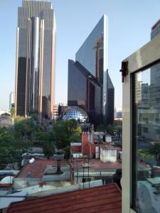 a view of the city from the roof of a building at Loft Corredor Financiero Reforma in Mexico City