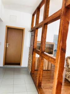 a room with a wooden door and a window at Ferienhof - Ferienwohnung in Gadebusch