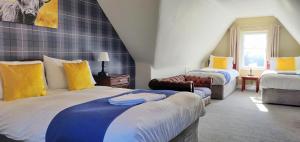 Postel nebo postele na pokoji v ubytování Hartfell Guest House