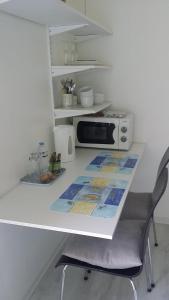 Kuchyň nebo kuchyňský kout v ubytování Chambre spacieuse, moderne et très confortable à Perros-Guirec