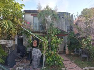 a courtyard of a house with a balcony at Caribbean Paradise in Cancún