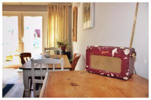 a suitcase sitting on top of a wooden table at Self Contained Flat with Private Garden & Parking in Sandown