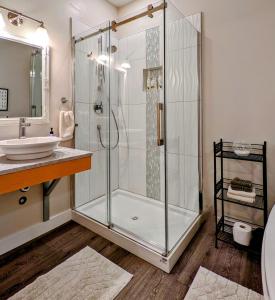 a bathroom with a shower and a sink at Maple Rise Guesthouse in Duncan