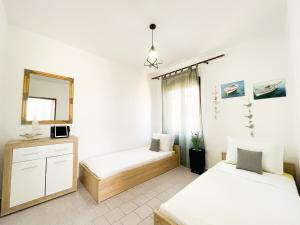 Tempat tidur dalam kamar di Sea View Apartment Amaro
