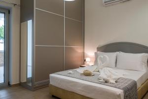 Posteľ alebo postele v izbe v ubytovaní Cataleya Villa Chania