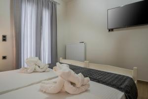 Posteľ alebo postele v izbe v ubytovaní Cataleya Villa Chania