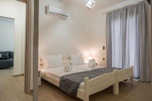 Posteľ alebo postele v izbe v ubytovaní Cataleya Villa Chania + 37 fotografií